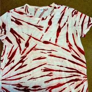 Size XL LuLaRoe short sleeve boyfriend tee. White with pink colors. Like new!